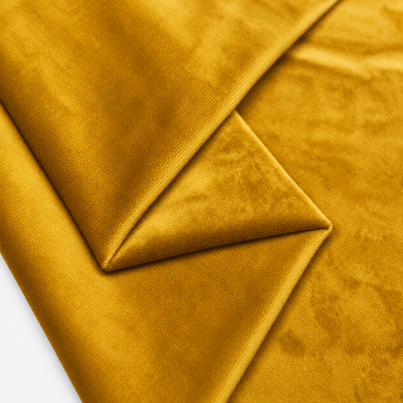 Mustard plush velvet fabric close-up