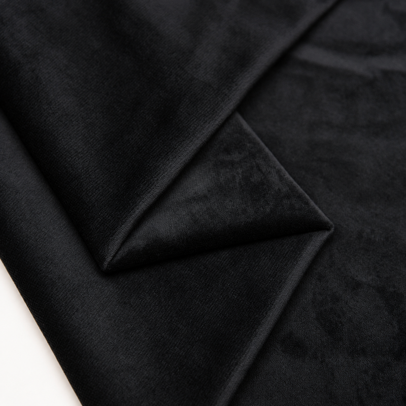 Black plush velvet fabric close-up