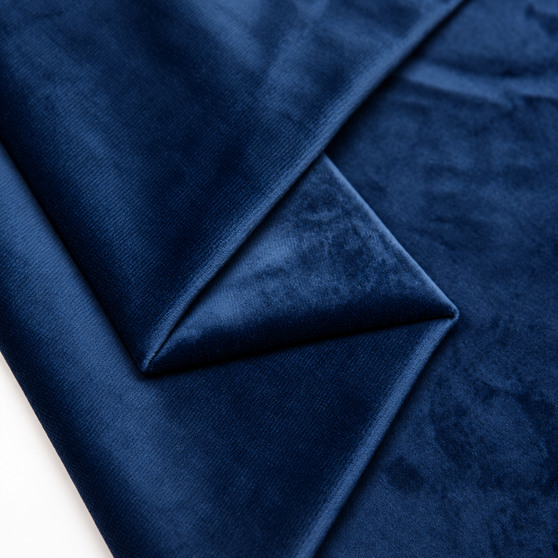 Navy plush velvet fabric close-up