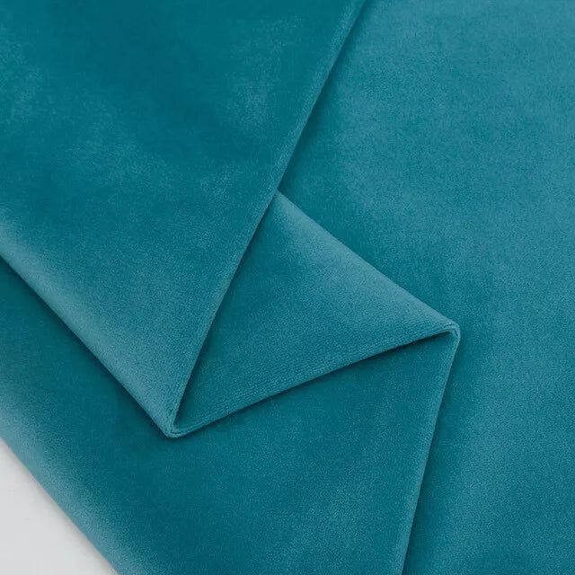 Turquoise plush velvet fabric close-up